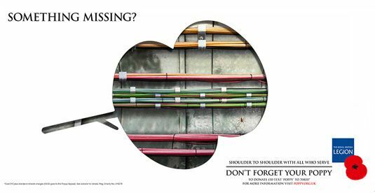 Kampania Poppy Appeal obejmuje trzy reklamy prasowe z wyciętym makiem, przedstawiającym w tym przypadku mechanikę londyńskiego metra. Obraz © Taylor James